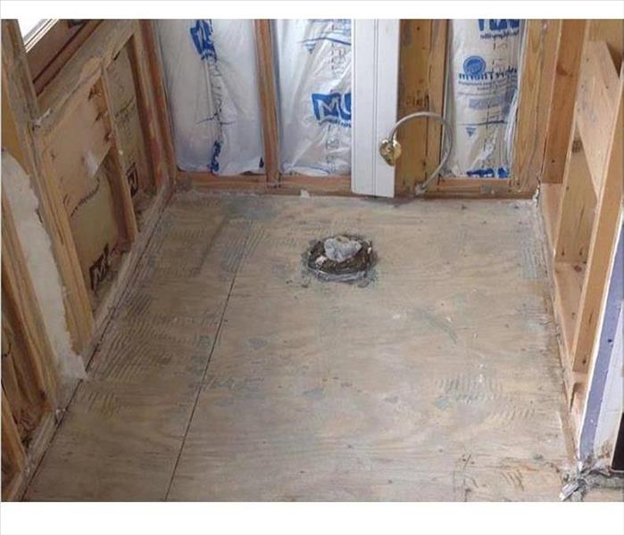 bathroom is cleared of walls and flooring shows the insulation