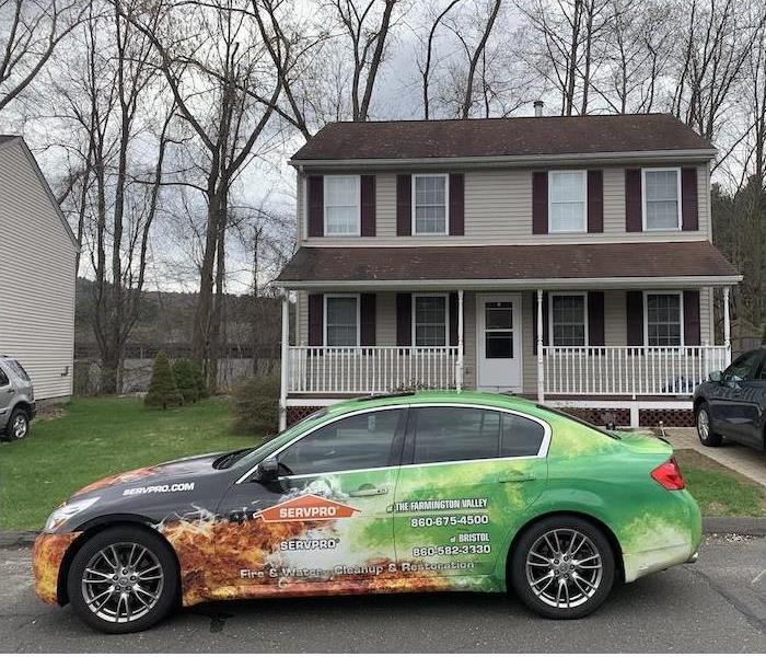 SERVPRO car in front of a home