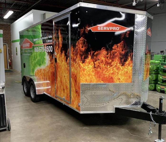 servpro trailer in warehouse with a flames wrap